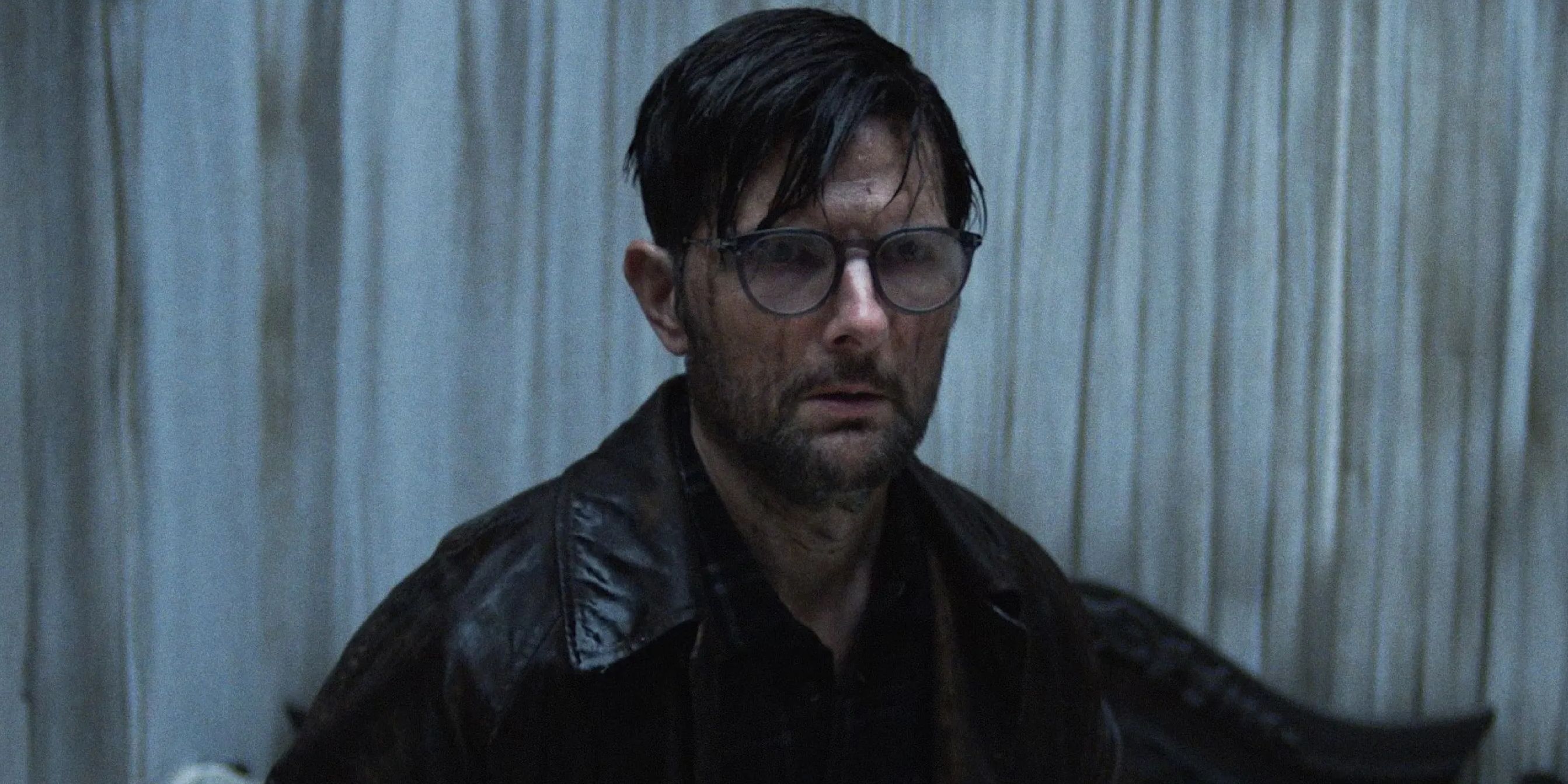 Adam Scott investigating shadowy hotel corridors in Hokum